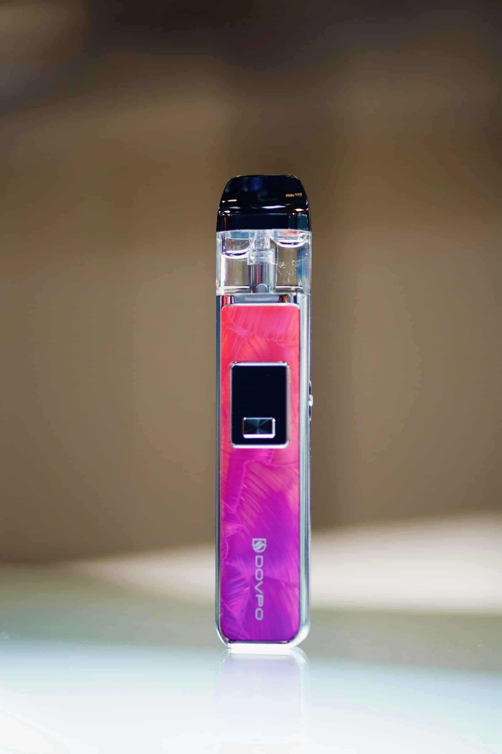 Rows of e-liquid bottles lined up on a shop counter